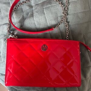 Red shiny bag with silver chains